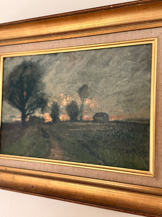 Framed painting of a landscape with trees and a path.