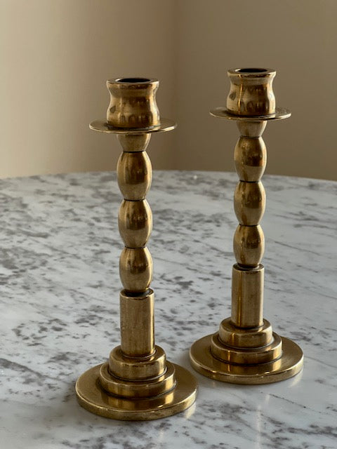 pair of short brass candlesticks